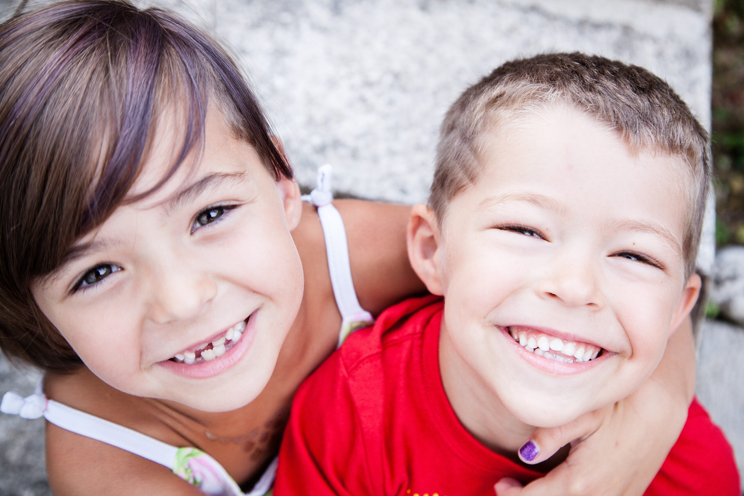 Little siblings with big smiles